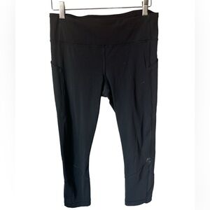 Lululemon Athletica Black crop leggings size 8. pkts. Paint spots as shown.